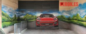 empresa graffitis puertas garaje parking coche rojo paisaje